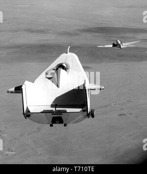 M2-F1 lifting body aircraft towed by the Douglas C-47 Skytrain at the Flight Research Center, Edwards, California, August 16, 1964. Image courtesy National Aeronautics and Space Administration (NASA). () Stock Photo