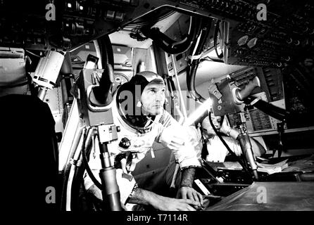 Photograph of the pilot Michael Collins at Apollo 11 Command Module, practicing docking hatch removal from CM simulator at NASA Johnson Space Center, Houston, Texas, June 28, 1969. Image courtesy National Aeronautics and Space Administration (NASA). () Stock Photo