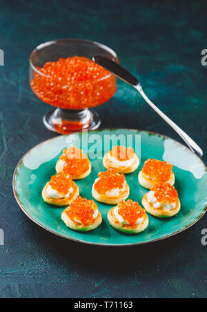 Delicious appetizer with red caviar. Stock Photo