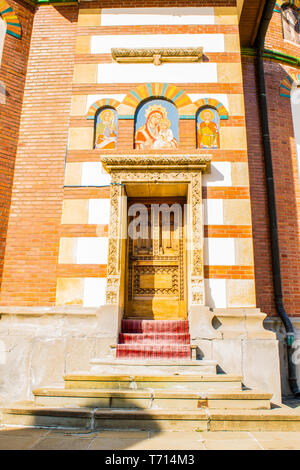 Sinaia, Romania - March 09, 2019: back entrance, wood door,  Sinaia Monastery located in Sinaia, Prahova, Romania. Stock Photo
