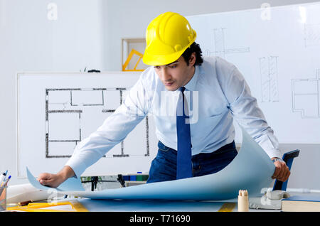 Young handsome architect working on the project Stock Photo