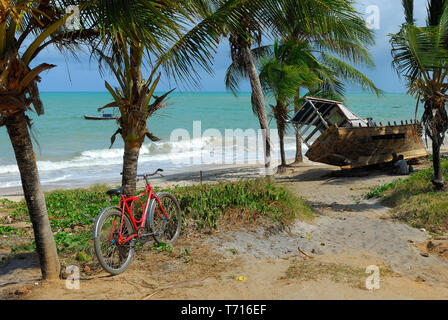 Veracruz, MEXICO, October 29, 2009: Bike and boat in a tropical beach. Stock Photo