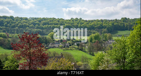 View across Sheepscombe with village church, St John the Apostle, The Cotswolds,United Kingdom Stock Photo