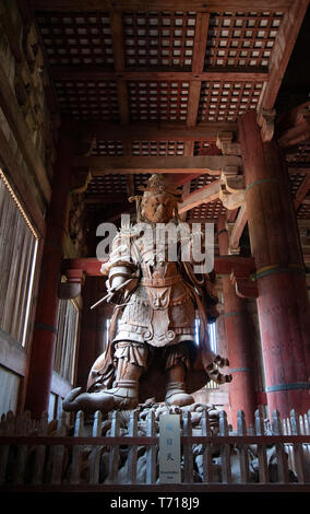 Wooden statue of Komokuten, one of a pair of Celestrial Guardians in the Daibutsuden or Great Buddha Hall, Todaiji Tempe in Nara, Japan Stock Photo