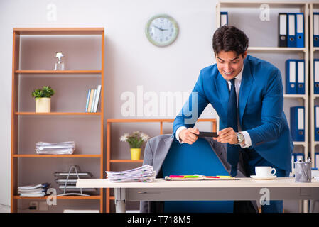 Employee stealing important information in industrial espionage Stock Photo