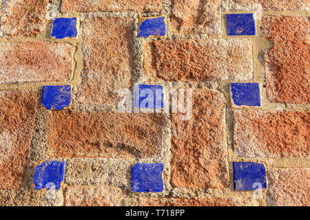 Clay and blue Italian geometric mosaic tiled  floor Stock Photo