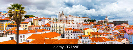 Lisbon, Portugal city skyline over the Alfama district. Summertime sunshine day cityscape in the Alfama, historic old district Alfama in Lisbon, Portu Stock Photo