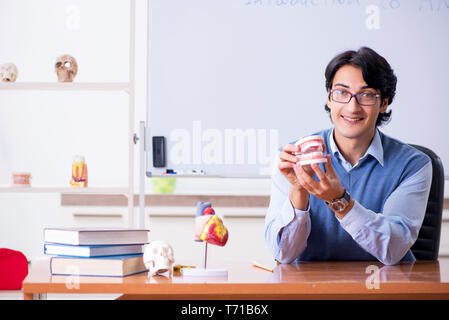 Young lecturer teacher teaching anatomy Stock Photo