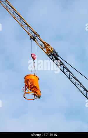 construction crane lifting concrete Stock Photo