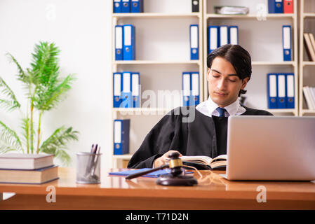 Young handsome judge working in court Stock Photo
