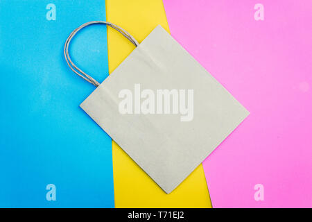 Brown paper bag on colourful background Stock Photo
