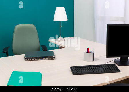laptop and monitor on a desk Stock Photo
