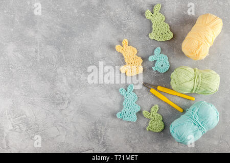 Easter decoration, bunny rabbits made of crochet colorful yarn Stock Photo