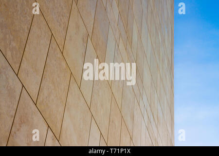 New modern ventilated stone wall made with different blocks of rectangular shape with wide joints Stock Photo