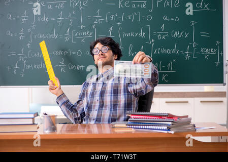 Funny male math teacher in the classroom Stock Photo