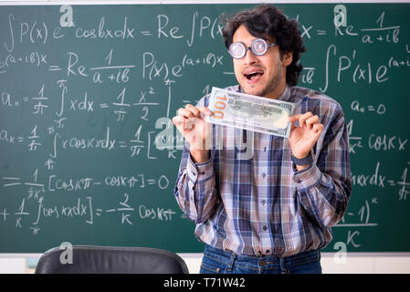 Funny male math teacher in the classroom Stock Photo