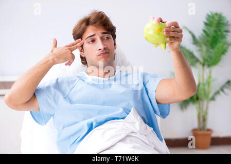 Young male patient lying on couch in hospital Stock Photo