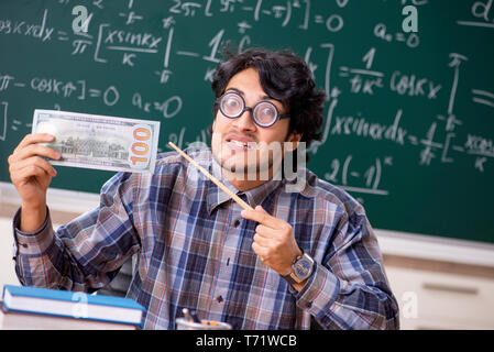 Funny male math teacher in the classroom Stock Photo