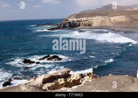 Stunning natural viewpoint with amazing cliffs and blue rough sea at north-west coast of Fuerteventura, Canary Islands, Spain Stock Photo