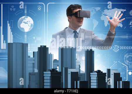 Man with virtual reality goggles doing urban planning Stock Photo