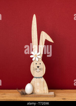 a sweet easter bunny figure with an egg Stock Photo