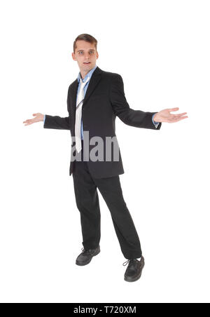 A man standing with hands outstretched is perplex Stock Photo