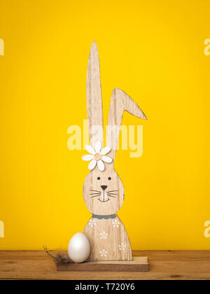 a sweet easter bunny figure with an egg Stock Photo