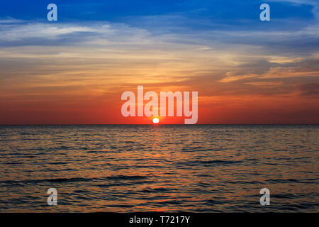 cloudy sunset over the ocean Stock Photo