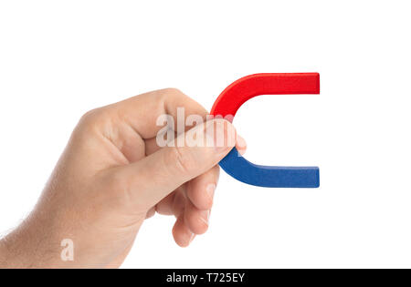Hand with magnet Stock Photo