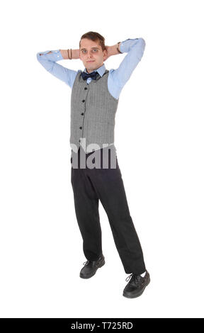 Business man standing with his hands behind his head Stock Photo