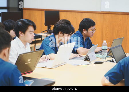 Groups of Computer Engineering students at Assumption University (ABAC) Working on their coding project in a classroom Stock Photo