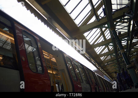 London Underground station in Earl's Court with trains and escalators Stock Photo