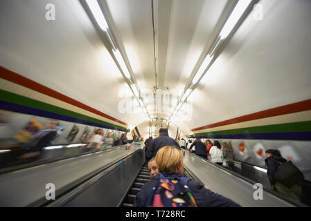 London Underground station in Earl's Court with trains and escalators Stock Photo