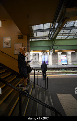 London Underground station in Earl's Court with trains and escalators Stock Photo