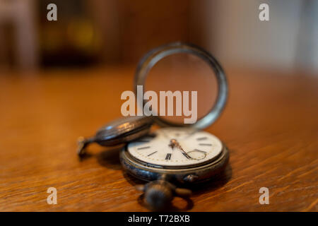 Two old pocket watches are on a table Stock Photo