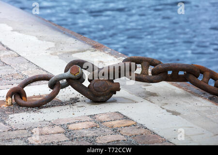old rusty chain in harbor Stock Photo