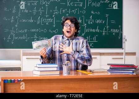 Funny male math teacher in the classroom Stock Photo