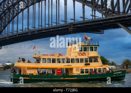 Closeup of Manley public Ferry passing under the Harbour Bridge in Sydney, Australia Stock Photo