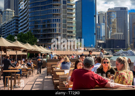 Bars and restaurants in the promenade Circular Quay next to the Opera House in Sydney, Australia Stock Photo