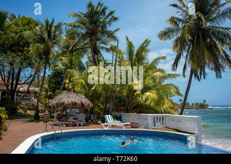 Infinity pool an palm tree at Casa Canada hotel on Big Corn Island, Nicaragua, Central America Stock Photo