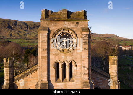 Aerial drone view of clock face on old church tower Stock Photo