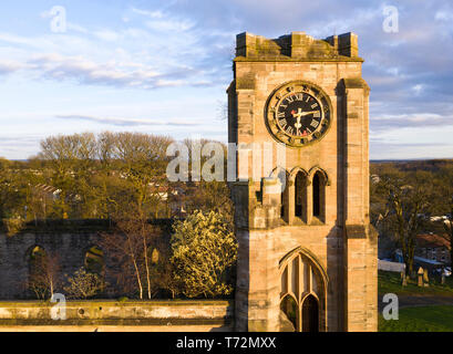 Aerial drone view of clock face on old church tower Stock Photo