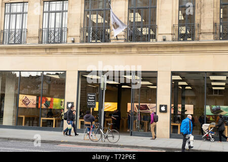 Cheeky advert offering cheaper Apple repairs - outside Apple Store ion Princes St, Edinburgh, Scotland, UK Stock Photo
