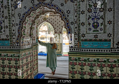 Star Mosque, is a mosque located in Armanitola area, Dhaka, Bangladesh. The mosque has ornate designs and is decorated with motifs of blue stars. It was built in the first half of the 19th century by Mirza Golam Pir. Stock Photo