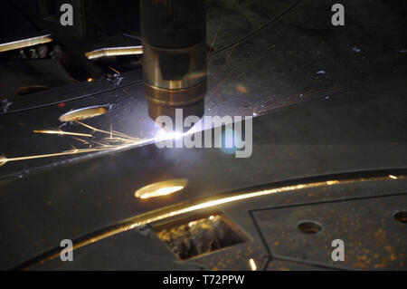 laser cutting torch machine in an industrial plant cuts sheet metal. Industry Stock Photo