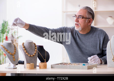 White Bearded Old Jeweler At Workshop Stock Photo - Alamy