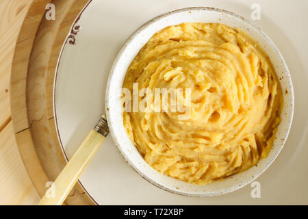 Pease pudding a traditional English savoury dish made of yellow split peas boiled in a stock with spices Stock Photo