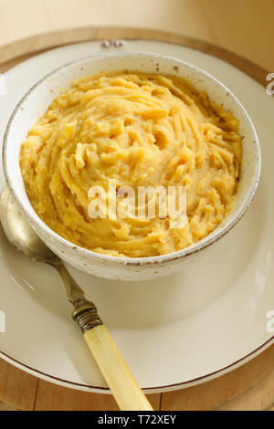 Pease pudding a traditional English savoury dish made of yellow split peas boiled in a stock with spices Stock Photo
