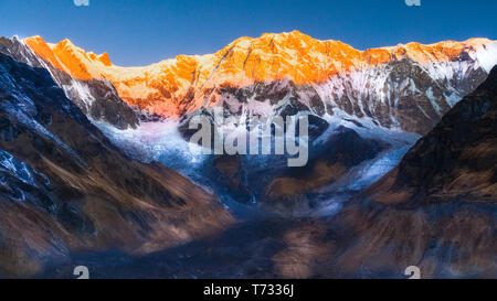 Annapurna base camp Golden hour during sunrise with blue sky Nepal Stock Photo