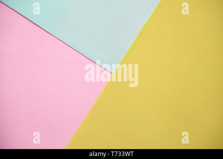 Multicolored background from yellow, pink and blue paper or cardboard. Stock Photo